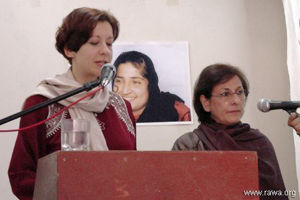 Francesca reads the message of RAWA supporters in Italy, an Iranian supporter of RAWA translates it to Farsi