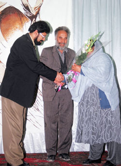 RAWA presents flowers to Taj Mohammad Ahmadzada and Sadique two brave Afghans