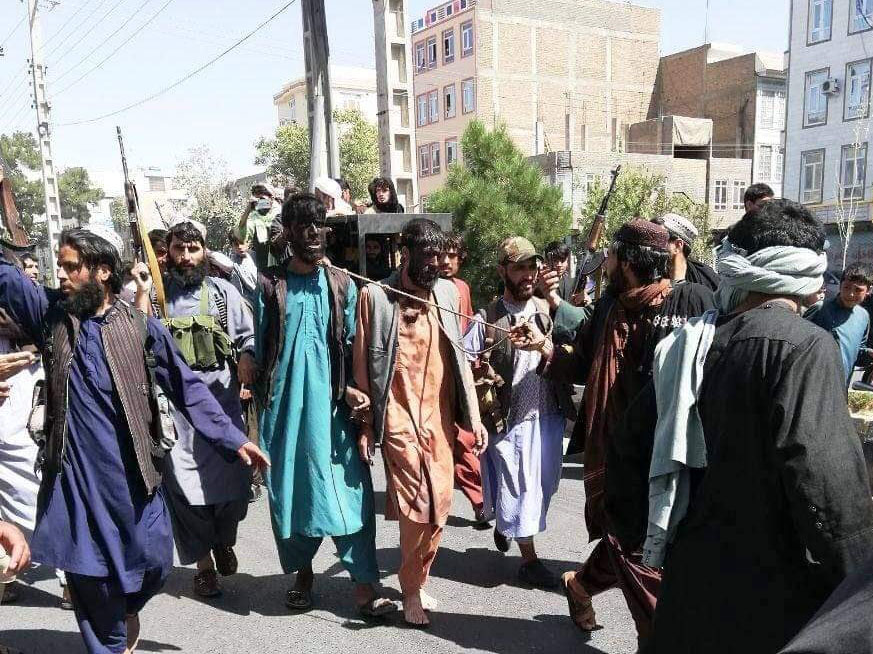 The Taliban dragged accused men through the streets with nooses around their necks and faces painted black