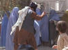 Taliban beating a woman in public